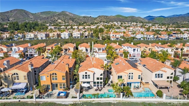 drone / aerial view with a mountain view and a residential view