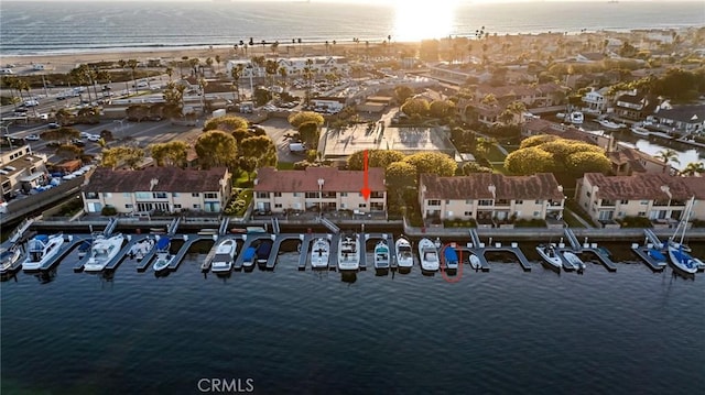 birds eye view of property with a water view and a residential view