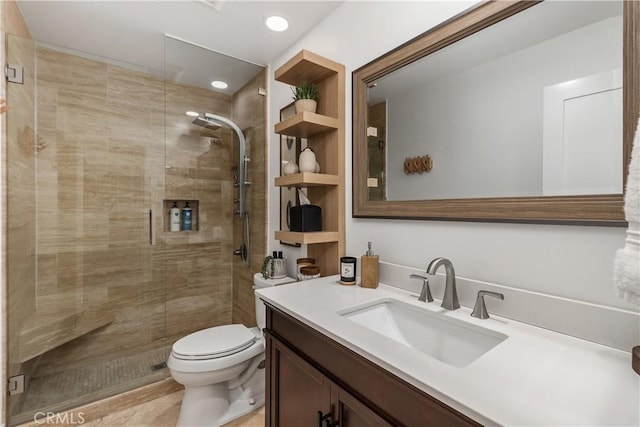 bathroom featuring a stall shower, vanity, toilet, and recessed lighting