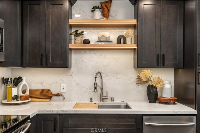 kitchen featuring open shelves, backsplash, dark brown cabinetry, a sink, and dishwasher