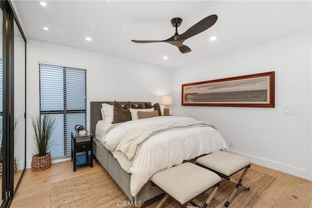 bedroom featuring baseboards, ceiling fan, recessed lighting, and light wood-style floors