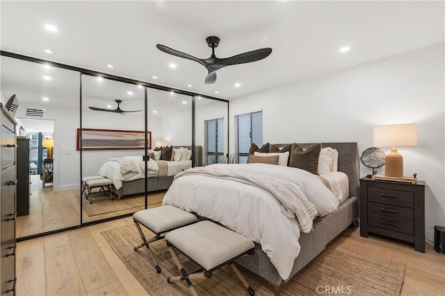 bedroom with light wood-style floors, recessed lighting, and visible vents