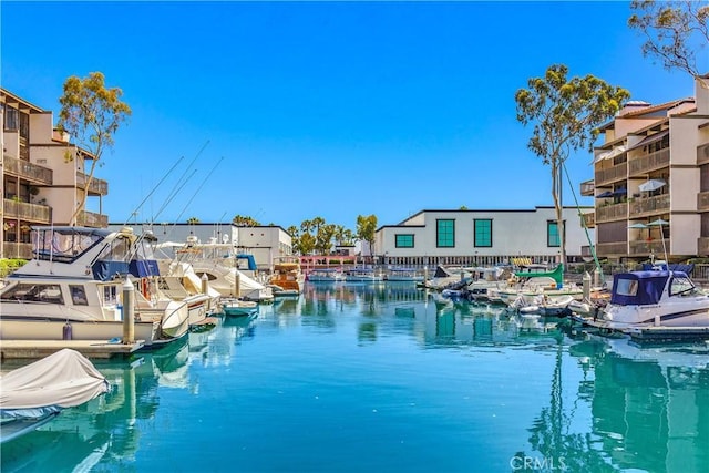 view of pool featuring a water view and a boat dock