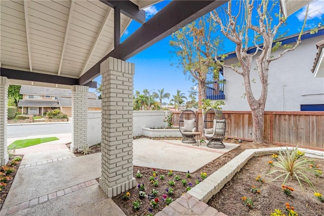 view of patio featuring fence