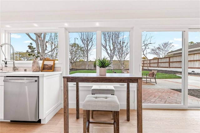 dining space with light wood finished floors