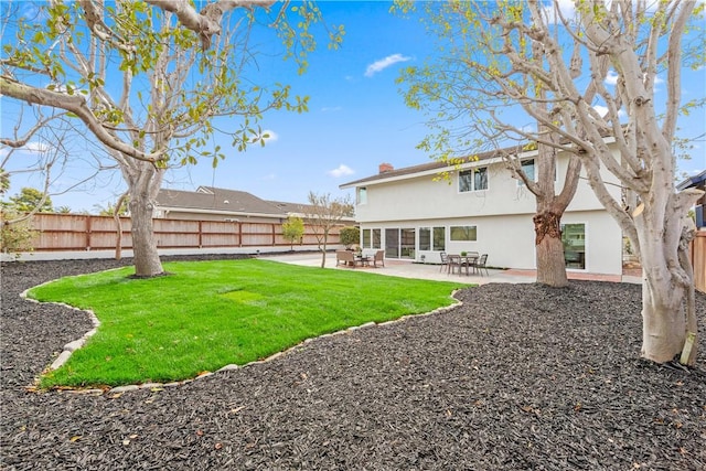 view of yard with a patio area and a fenced backyard