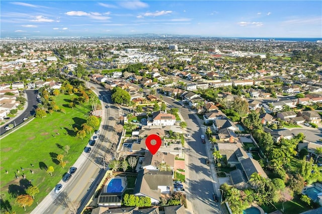 birds eye view of property with a residential view