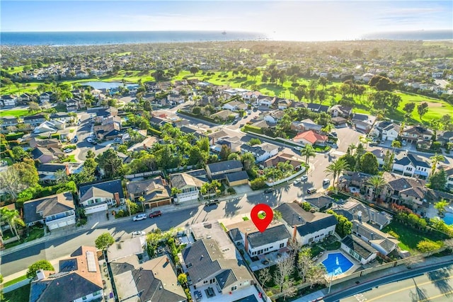 birds eye view of property featuring a water view and a residential view