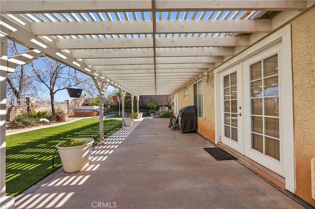 view of patio / terrace with grilling area and a pergola