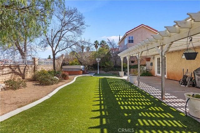 view of yard featuring a jacuzzi, a patio area, a pergola, and a fenced backyard