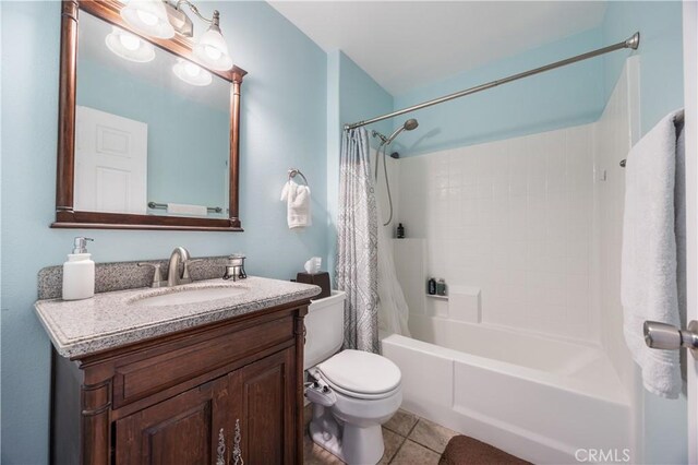 full bathroom featuring tile patterned floors, toilet, vanity, and shower / bath combo