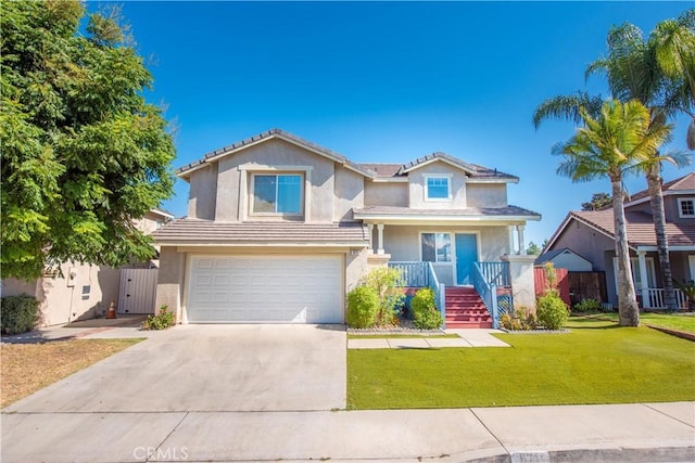 view of front of home featuring an attached garage, driveway, a front lawn, and fence