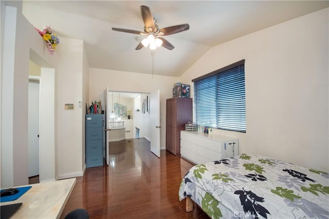 bedroom with a ceiling fan, vaulted ceiling, and wood finished floors