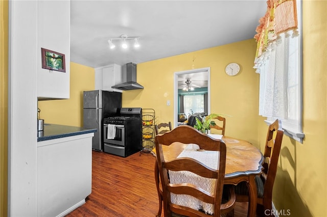 dining area featuring dark wood-type flooring