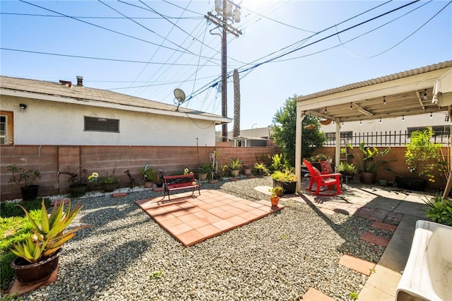 view of yard featuring a patio area and a fenced backyard