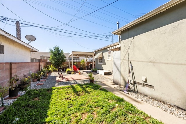 view of yard with a patio area and a fenced backyard