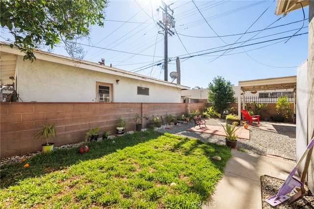 view of yard with a patio area and a fenced backyard