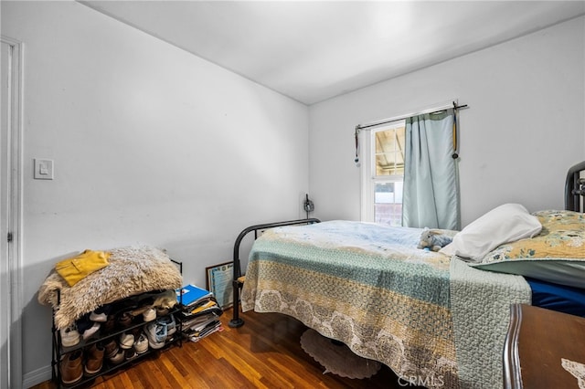 bedroom featuring wood finished floors