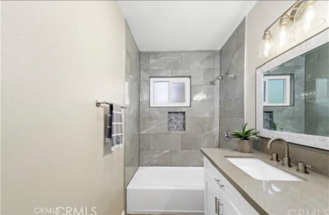 full bath with vanity and shower / bathtub combination