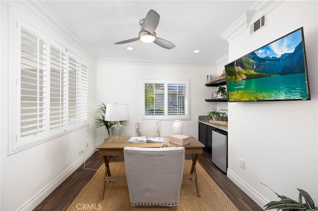 living area featuring visible vents, baseboards, dark wood finished floors, and crown molding