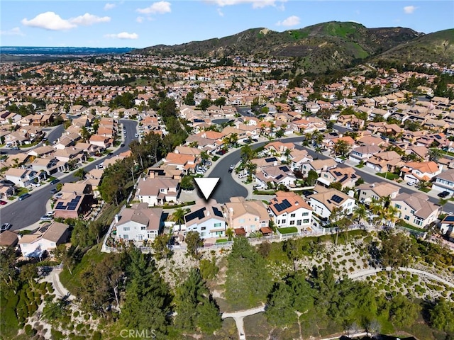 birds eye view of property with a mountain view and a residential view