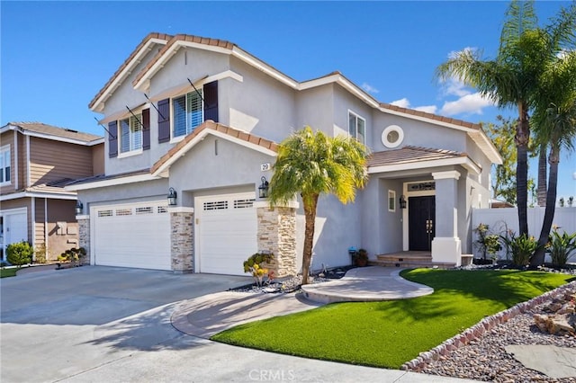 view of front of property with stucco siding, stone siding, fence, concrete driveway, and a garage