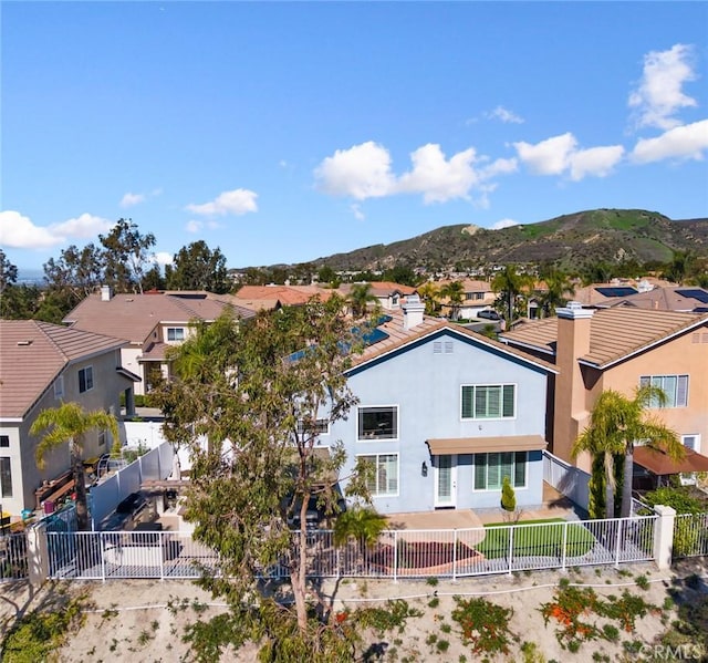 drone / aerial view featuring a mountain view and a residential view