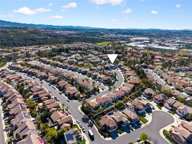 birds eye view of property with a mountain view and a residential view