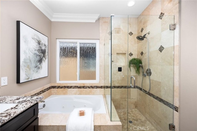 full bath featuring a tub with jets, a stall shower, vanity, and ornamental molding