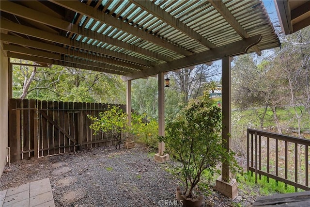 exterior space with fence and a pergola