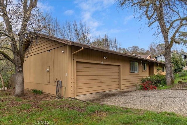 garage featuring driveway