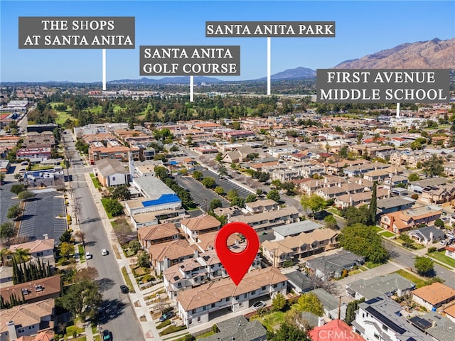 drone / aerial view featuring a mountain view and a residential view