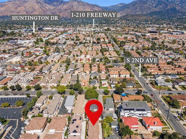 birds eye view of property with a residential view and a mountain view