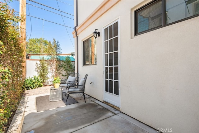 view of patio featuring fence