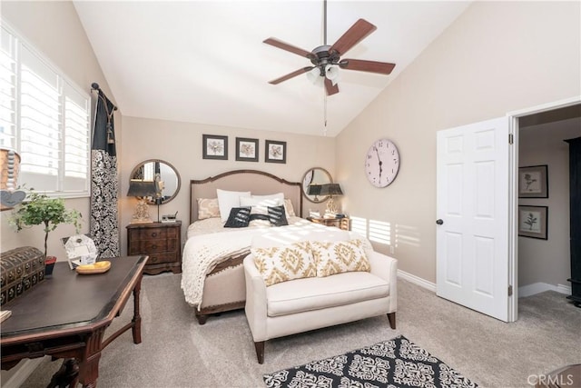 bedroom featuring carpet floors, vaulted ceiling, baseboards, and a ceiling fan