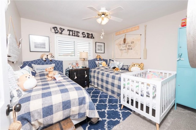 carpeted bedroom featuring a ceiling fan