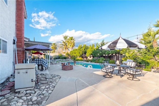 pool featuring a patio area and fence