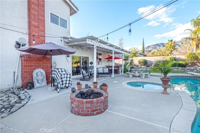 exterior space with a fire pit and outdoor dry bar