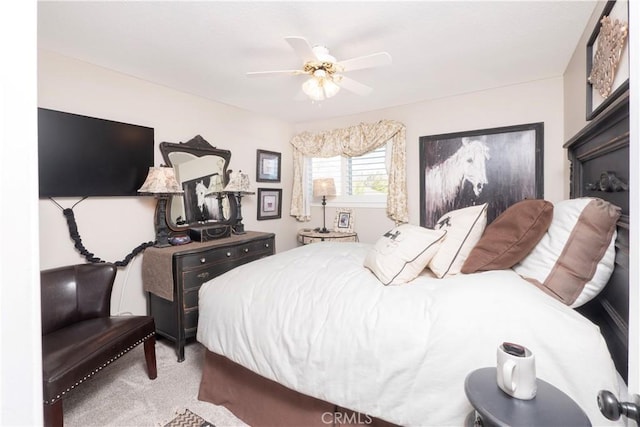 carpeted bedroom with a ceiling fan