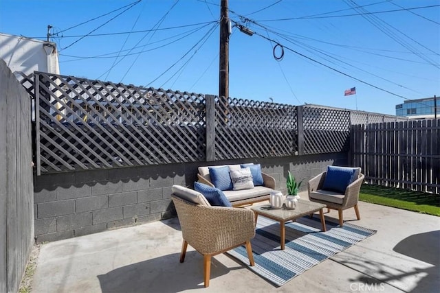 view of patio / terrace with a fenced backyard and an outdoor living space