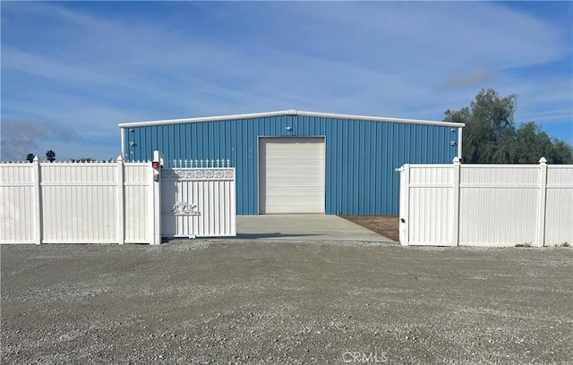 view of outbuilding featuring an outbuilding and fence