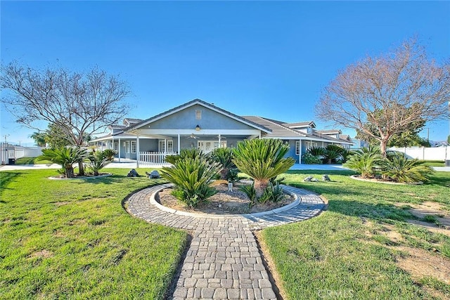 view of front facade featuring ceiling fan, fence, a front lawn, and stucco siding