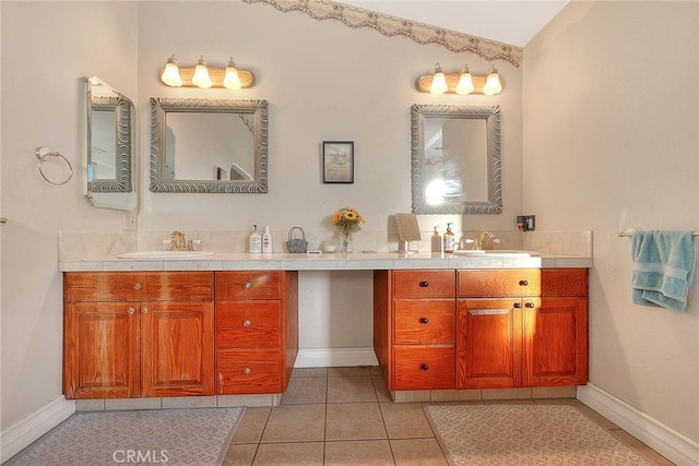 full bathroom with tile patterned flooring, vanity, and baseboards