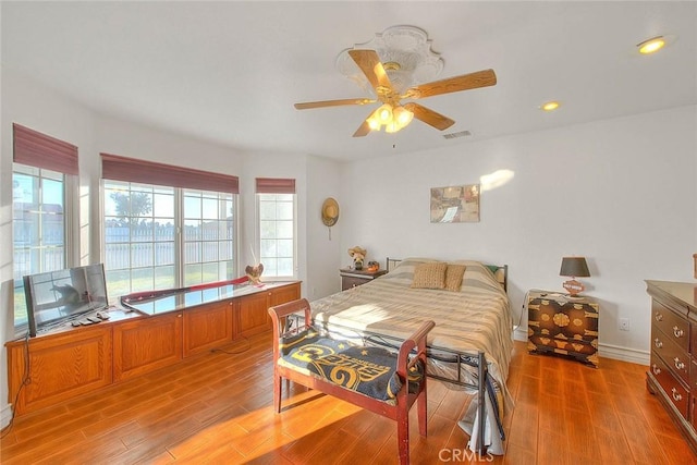 bedroom with light wood-style floors, visible vents, a ceiling fan, and recessed lighting