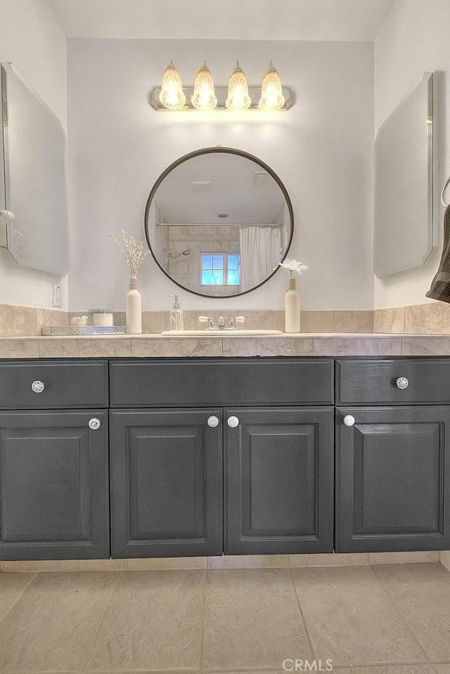 bathroom with double vanity and a sink