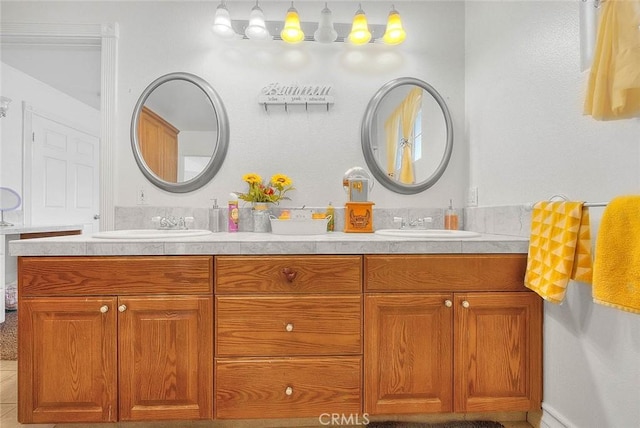 bathroom featuring double vanity and a sink