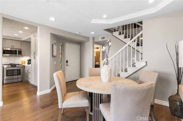 29416 Port Royal Way, Laguna Niguel, CA 92677 - dining room featuring stairs, baseboards, crown molding, wood finished floors, and recessed lighting