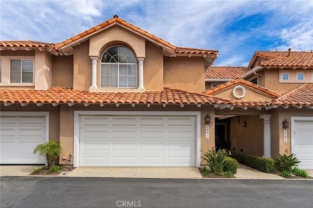 29416 Port Royal Way, Laguna Niguel, CA 92677 - mediterranean / spanish home featuring an attached garage, stucco siding, a tile roof, and driveway