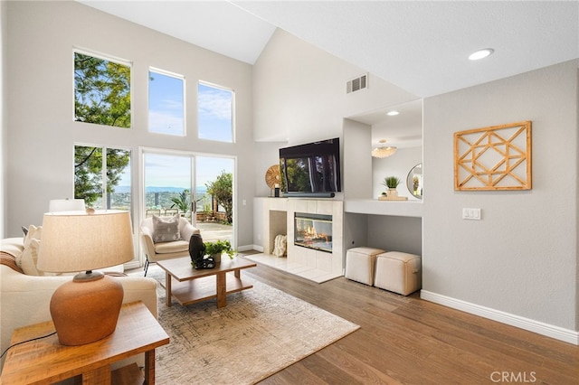 29416 Port Royal Way, Laguna Niguel, CA 92677 - living room featuring baseboards, a fireplace, high vaulted ceiling, and wood finished floors