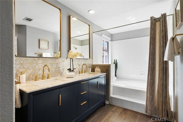 29416 Port Royal Way, Laguna Niguel, CA 92677 - bathroom featuring wood finished floors, decorative backsplash, and double vanity
